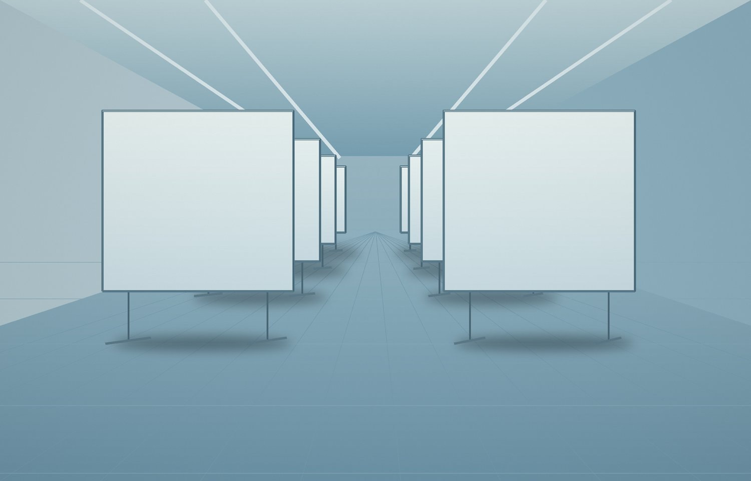 Blank white poster boards on metal stands in an empty hall.